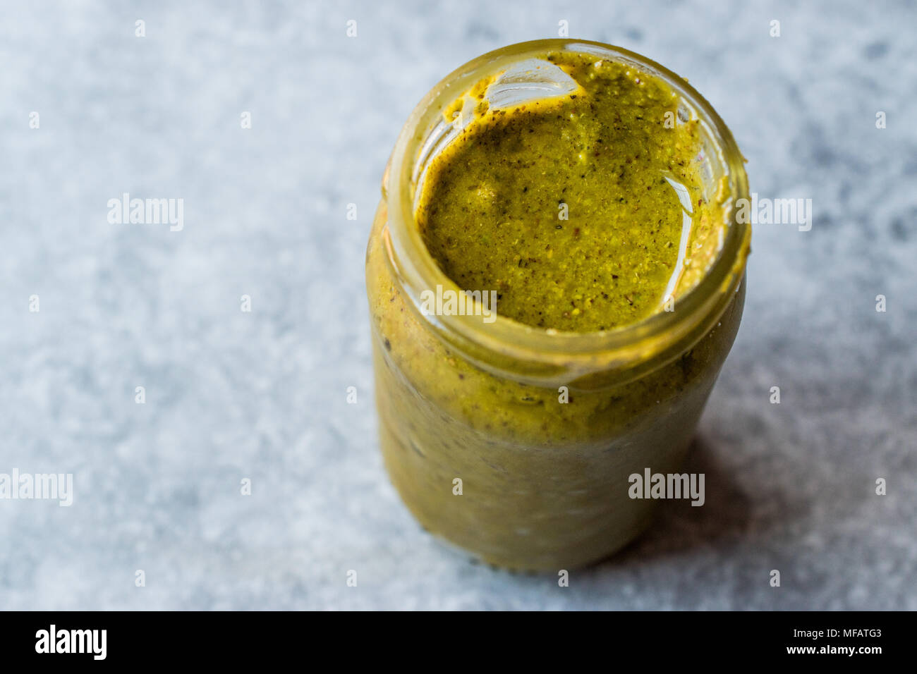 Green Pistachio Paste Urbech made with  Peanut Butter. Organic Food. Stock Photo