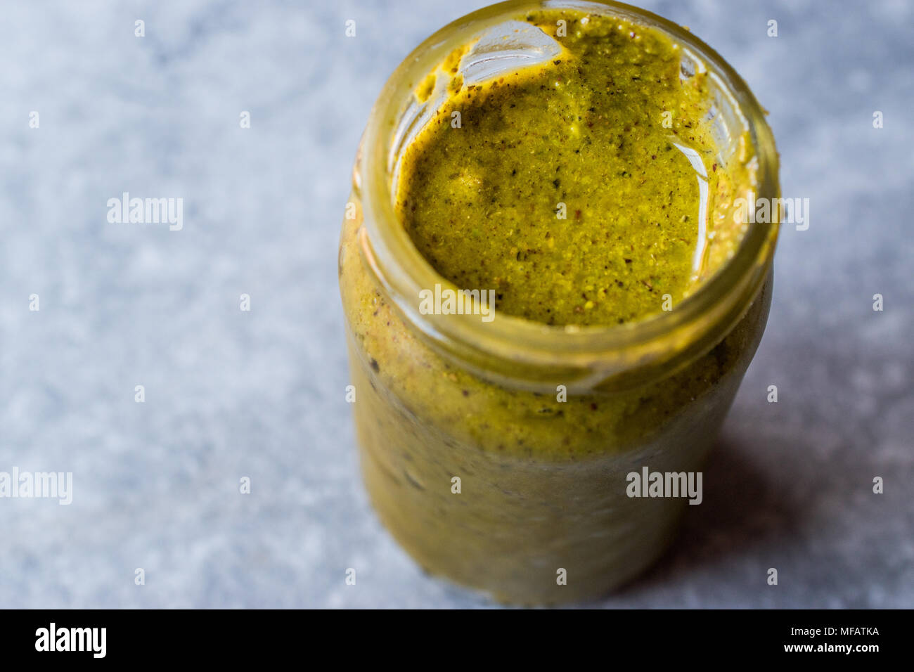 Green Pistachio Paste Urbech made with  Peanut Butter. Organic Food. Stock Photo
