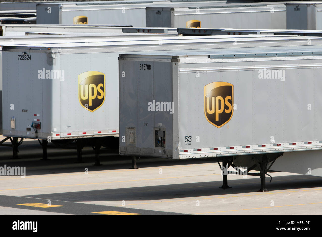 Delivery trucks and trailers at at UPS (United Parcel Service) facility in Horsham, Pennsylvania on April 22, 2018. Stock Photo