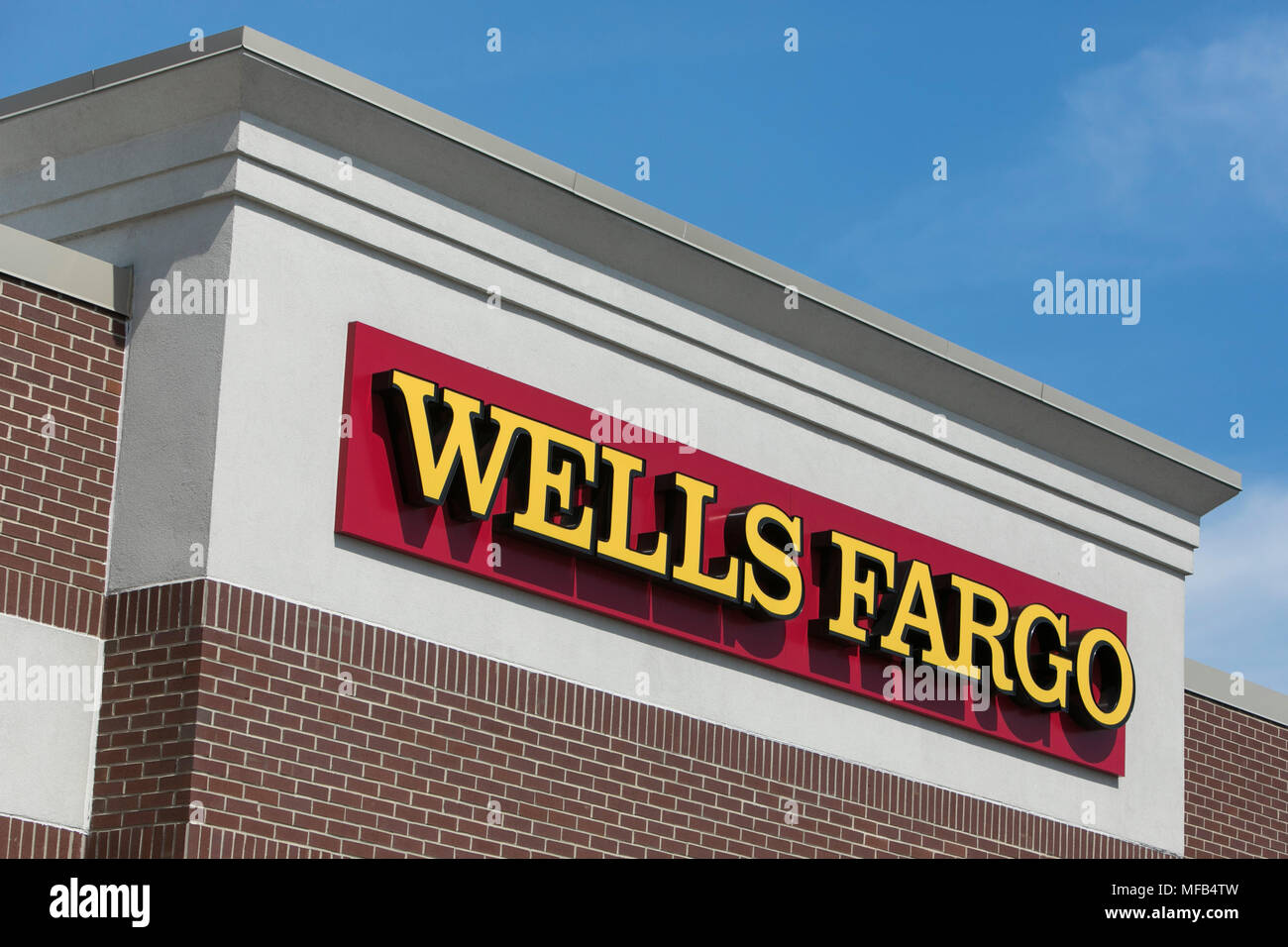A logo sign outside of a Wells Fargo bank branch in Reading, Pennsylvania, on April 22, 2018. Stock Photo