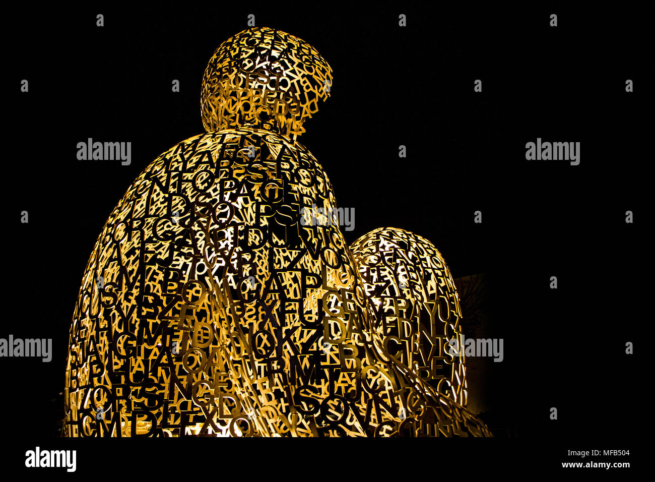 A detail Picture of the sculpture in the swedish town Boras. Made of letters in the shape of sitting man. Stock Photo