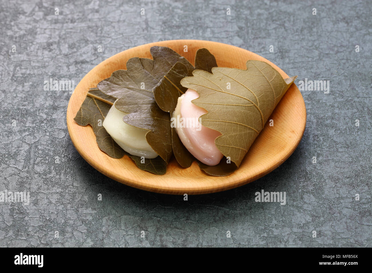 kashiwa mochi is white mochi surrounding a sweet anko filling with a