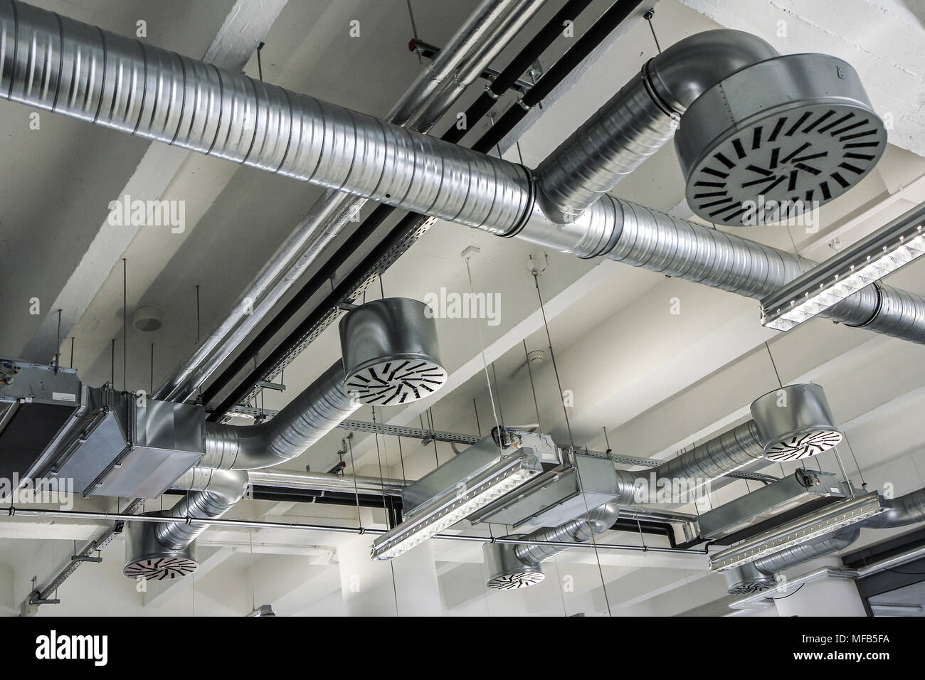 A detail of the air conditioning on the ceiling of the industrial building. Stock Photo