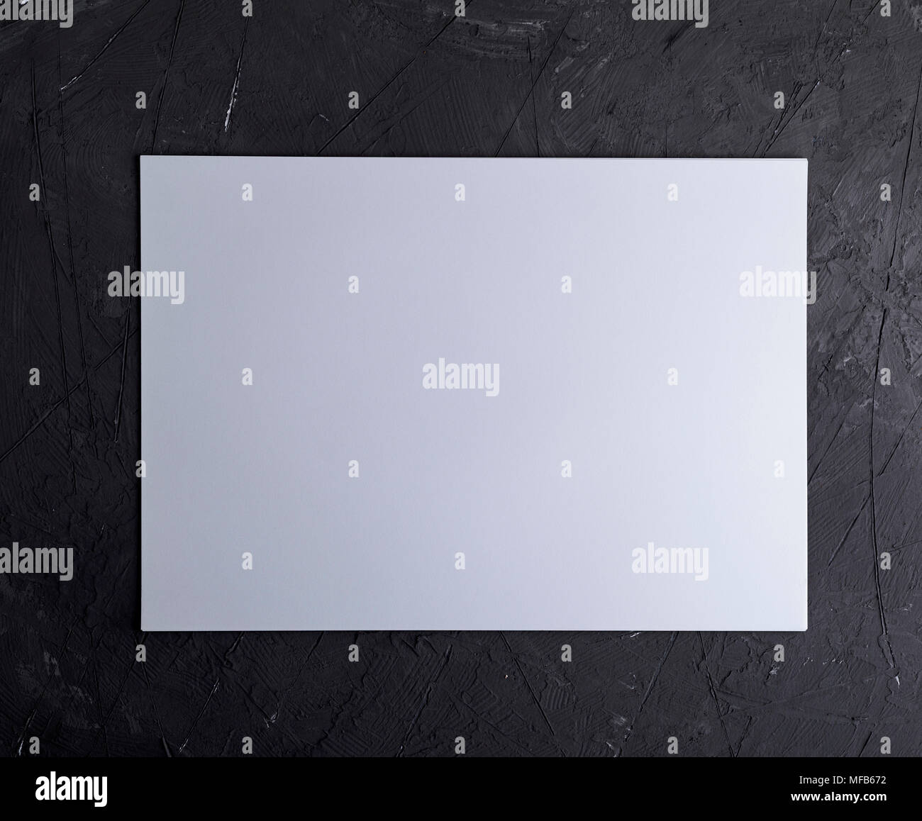 rectangular white blank sheet of paper on a black textural background Stock  Photo - Alamy