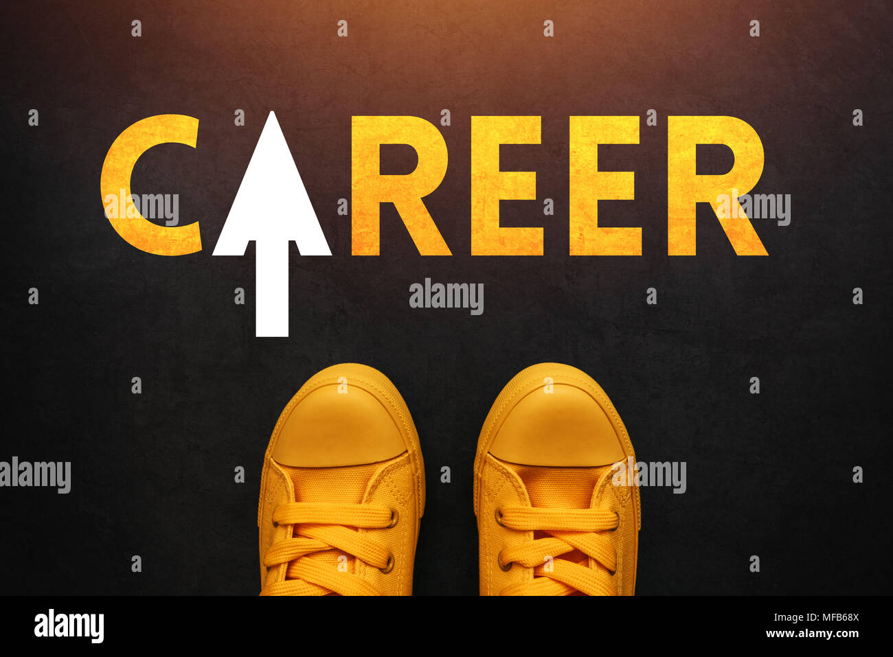 Career seeker looking for a job, conceptual image with young unemployed person in yellow sneakers standing Stock Photo
