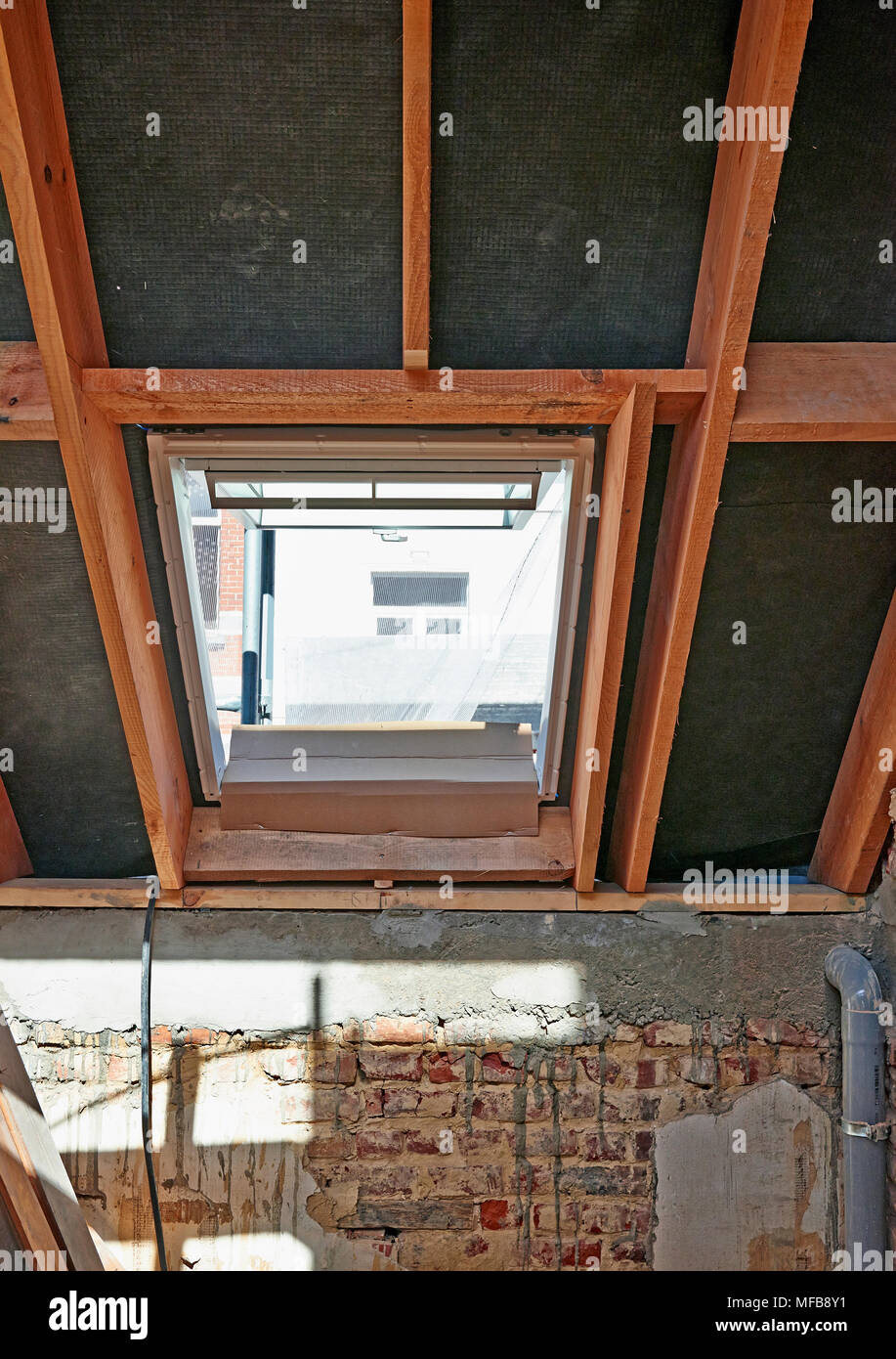 Attic ceiling frame and new window installed Stock Photo Alamy