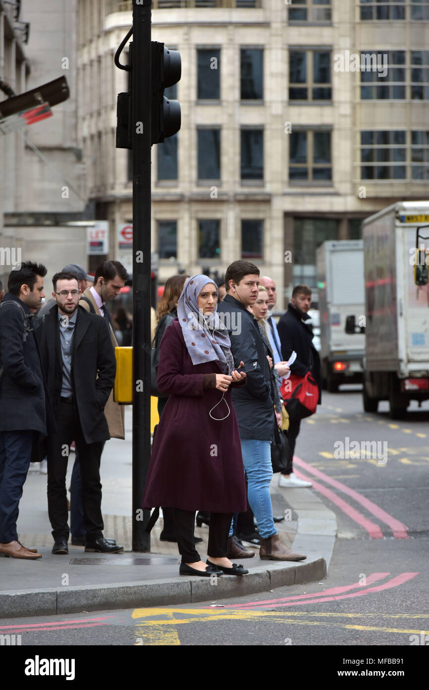 Office workers commuting to work during the morning rush hour in the City of London Stock Photo