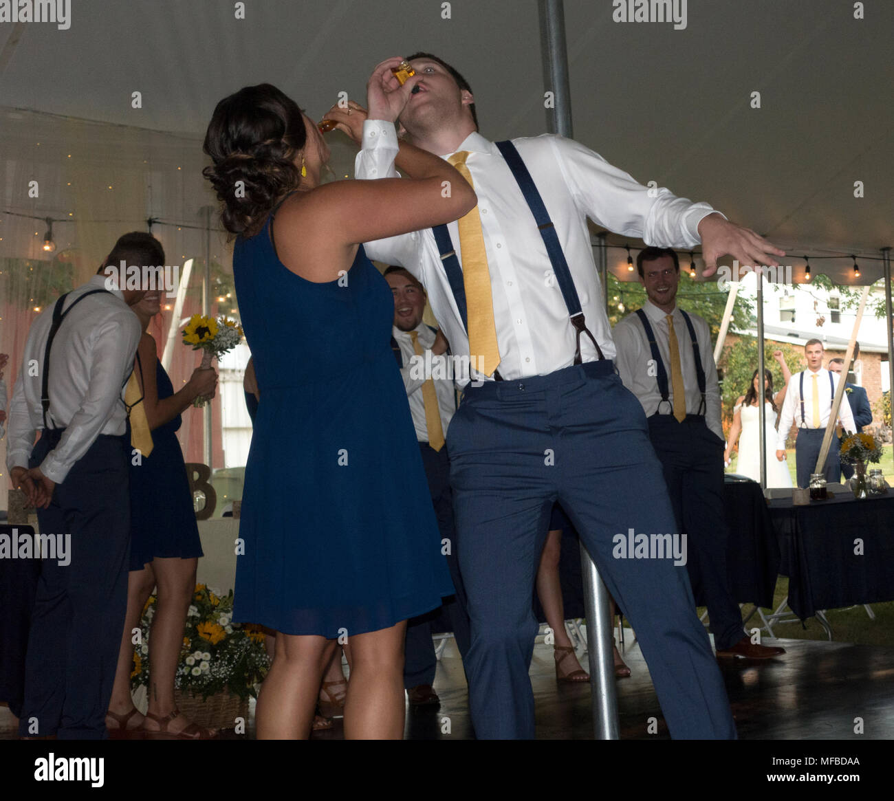 Wedding reception drinking shots through linked arms. Champaign Illinois IL USA Stock Photo