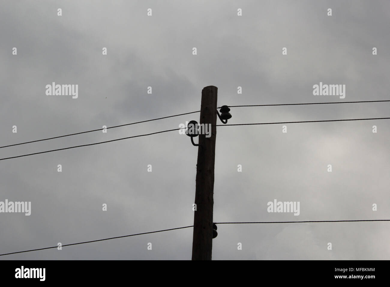 Wires pole with blue sky electrical wires on a background hi-res stock ...