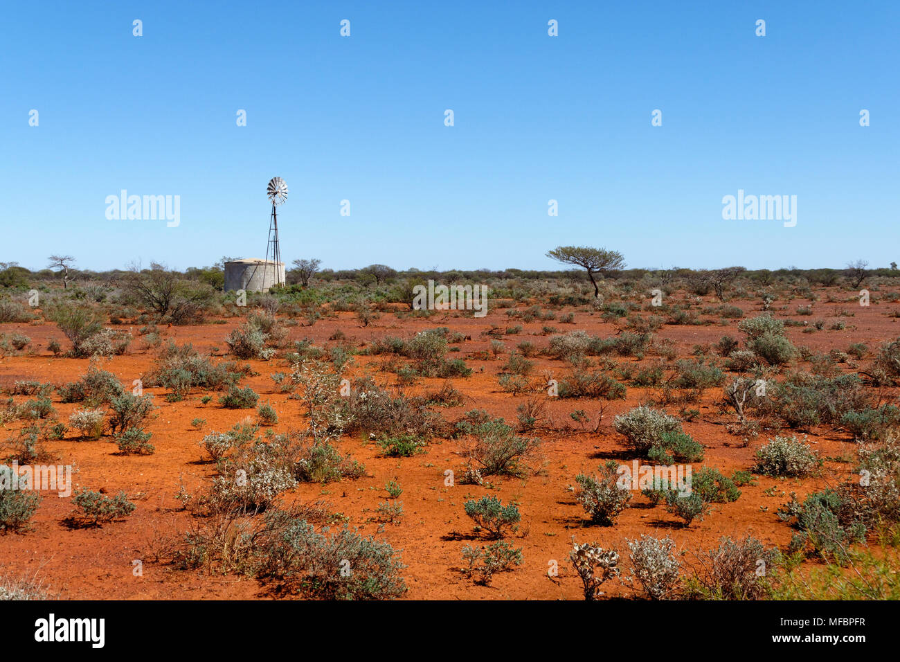 Windmill and water tank in outback Australian landscape, Yalgoo