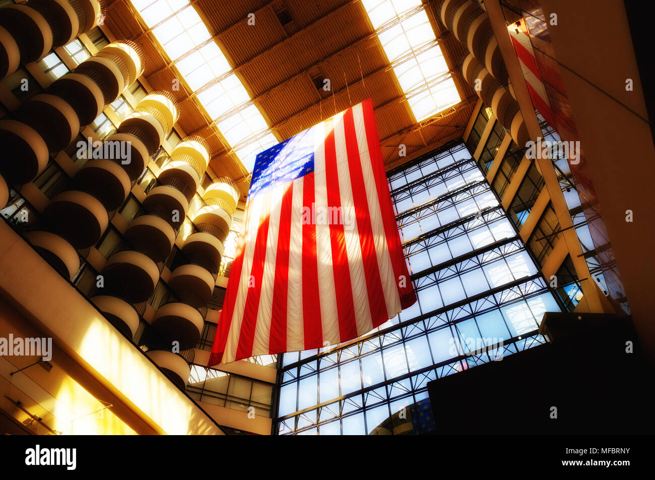 The American flag, or Stars and Stripes hanging in the Houston Galleria shopping mall, Houston Texas USA Stock Photo
