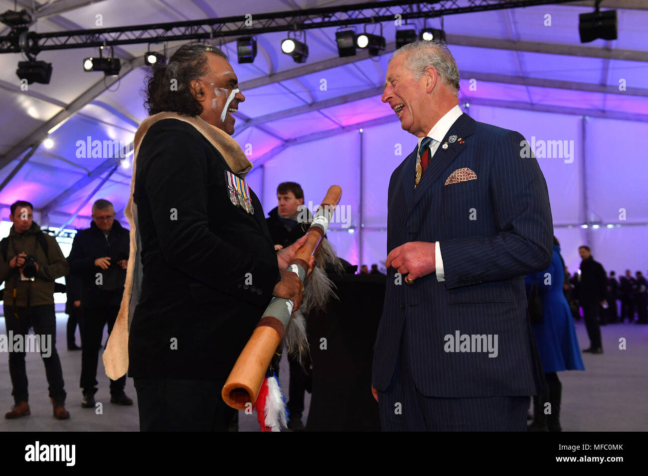The Prince of Wales meets indigenous didgeridoo player David Dahwurr Hudson after an early morning memorial at the Villers-Bretonneux Memorial in France, to mark the 100th anniversary of the Battle of Villers-Bretonneux. Stock Photo