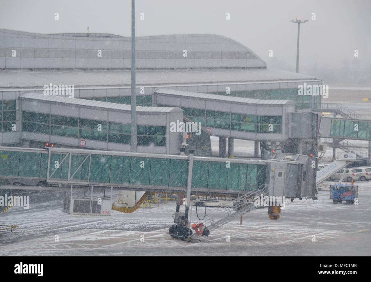 Snow covered airport shut down during snowstorm delay Stock Photo