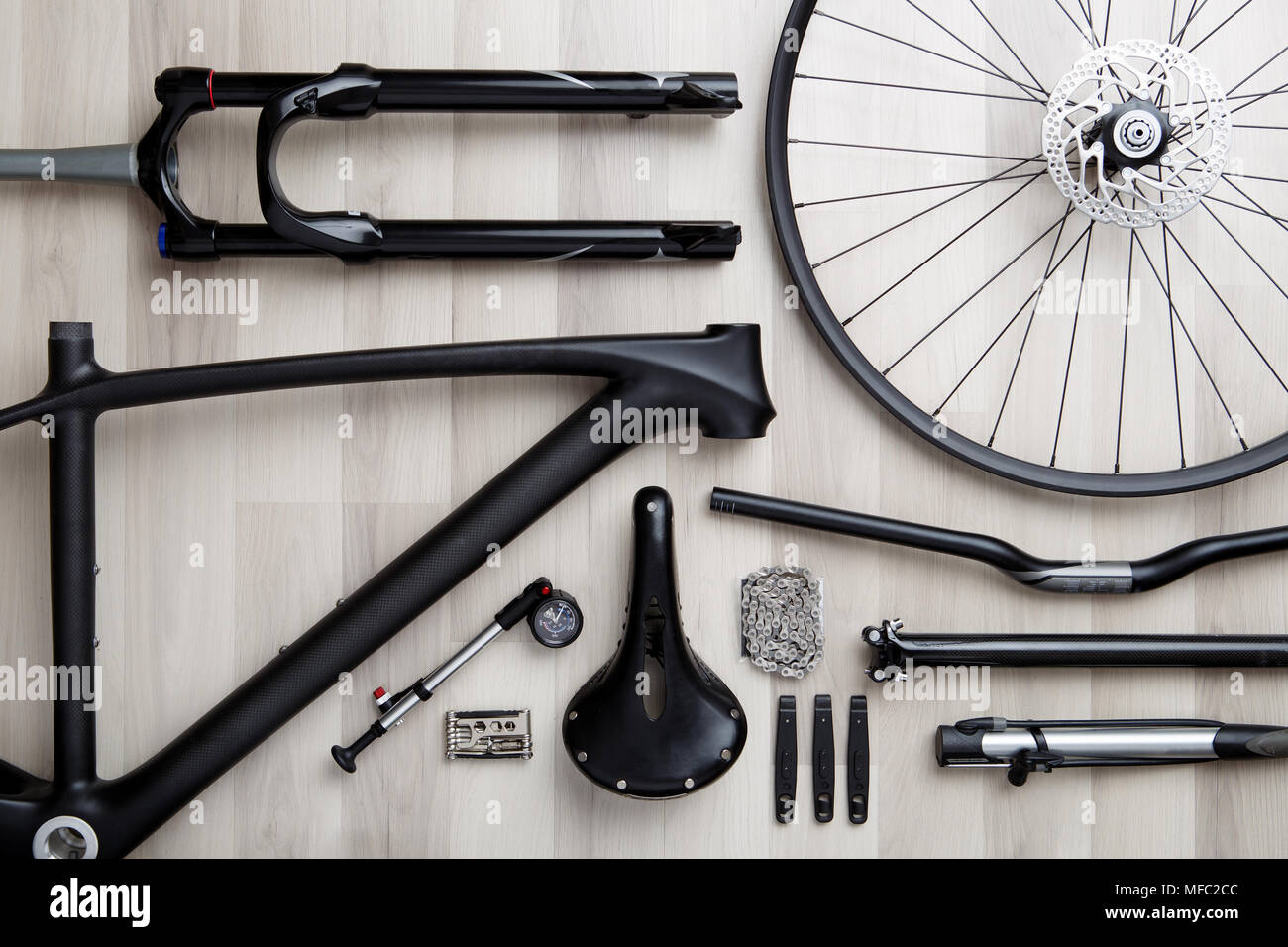 Photo of bicycle objects on wooden background. Stock Photo