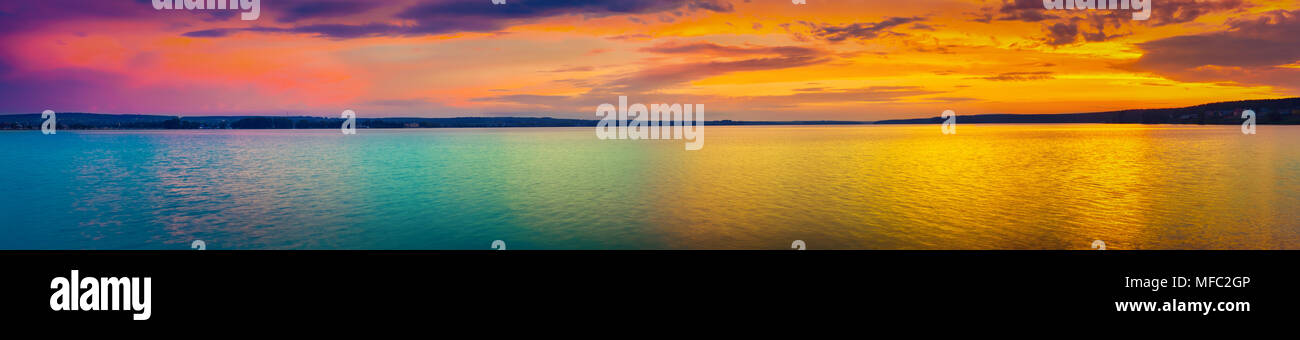 Sunset over the lake in Russia. Amazing landscape panorama Stock Photo