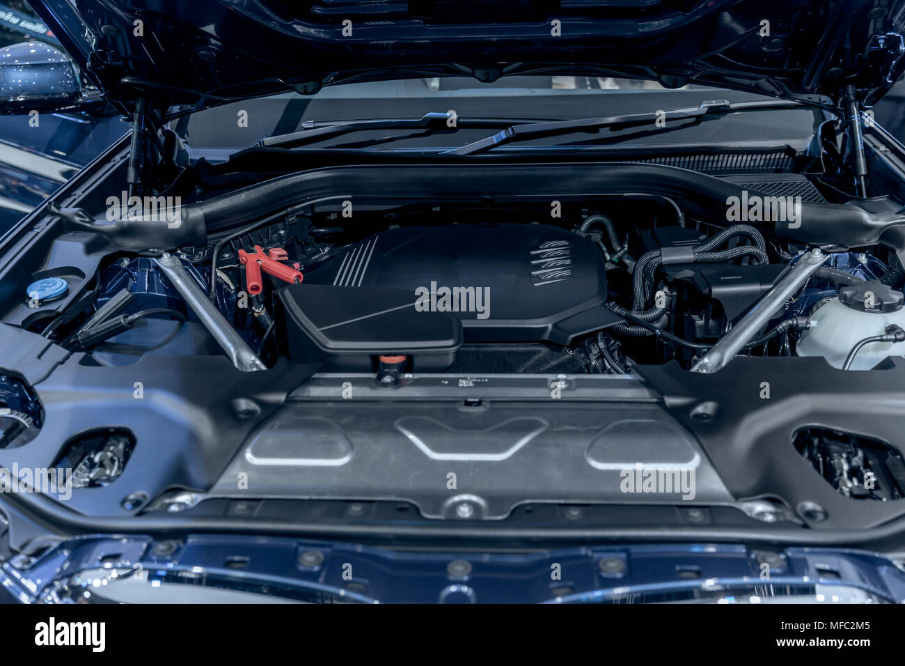 new car engine under vehicle hood Stock Photo