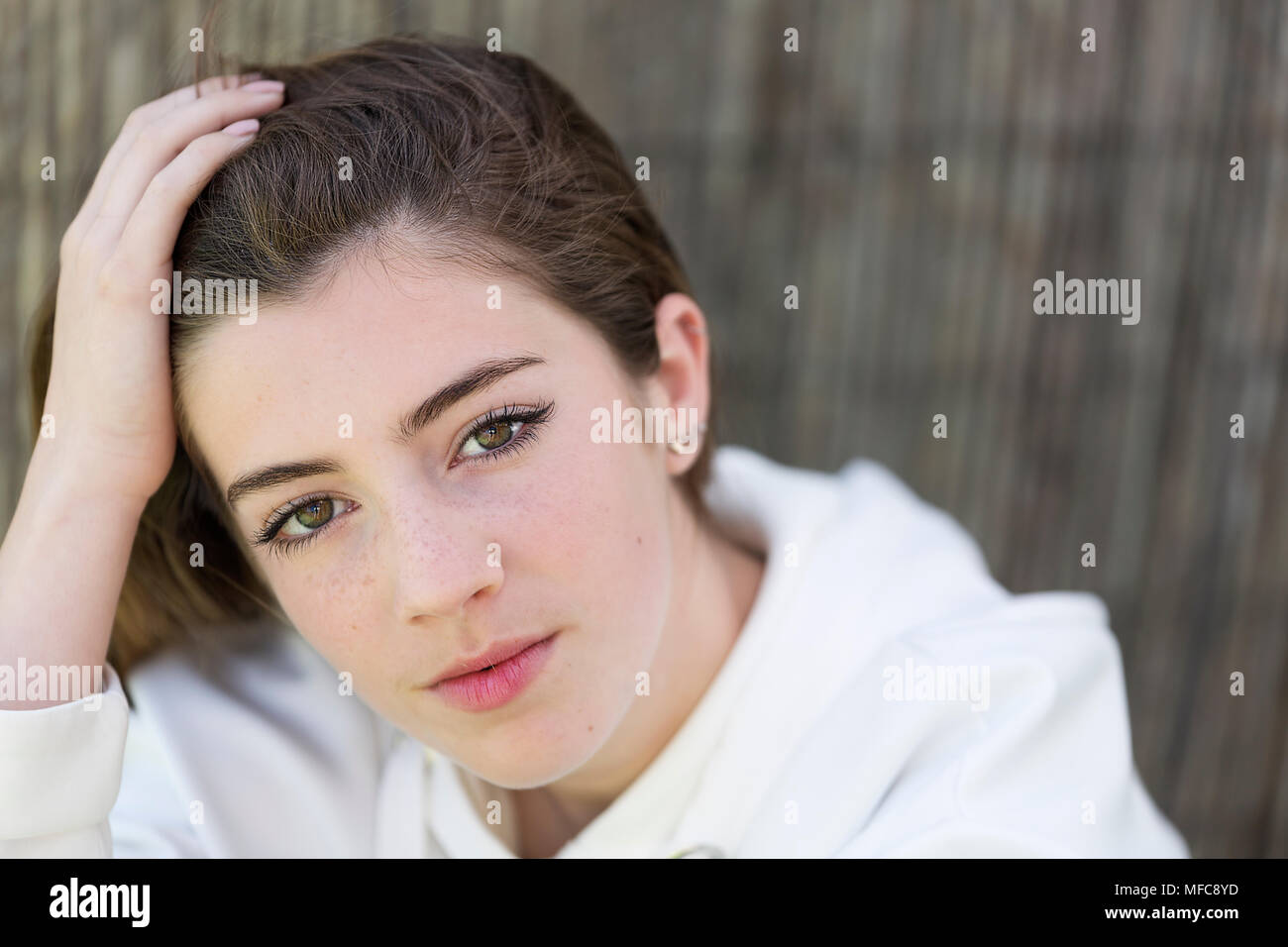 Model in a photography session. Horizontal shot with natural light. Stock Photo