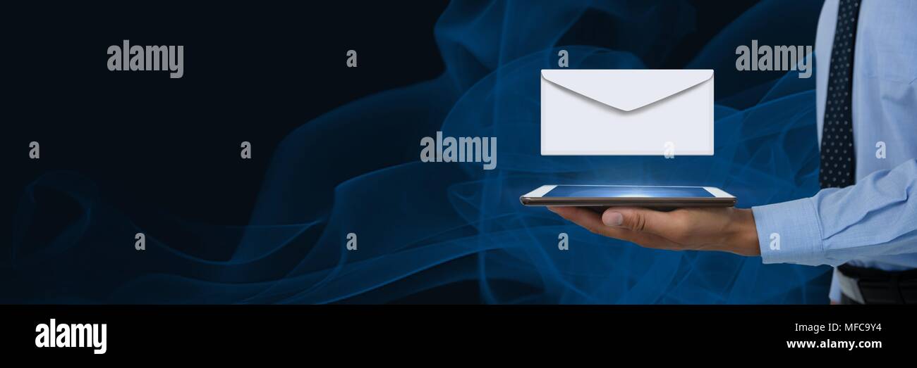 Envelope letter message and man using tablet Stock Photo