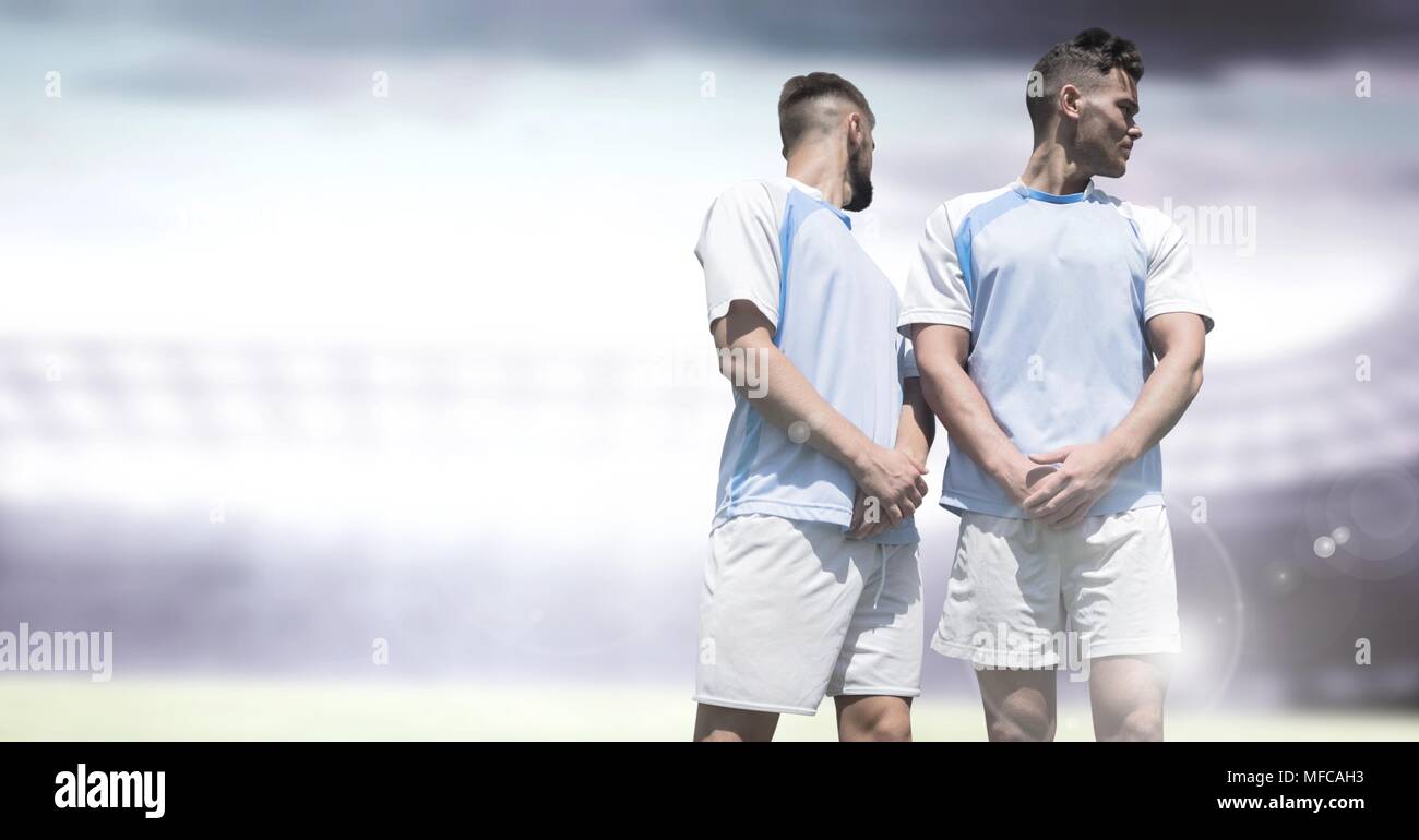 Soccer players in stadium light free kick wall Stock Photo