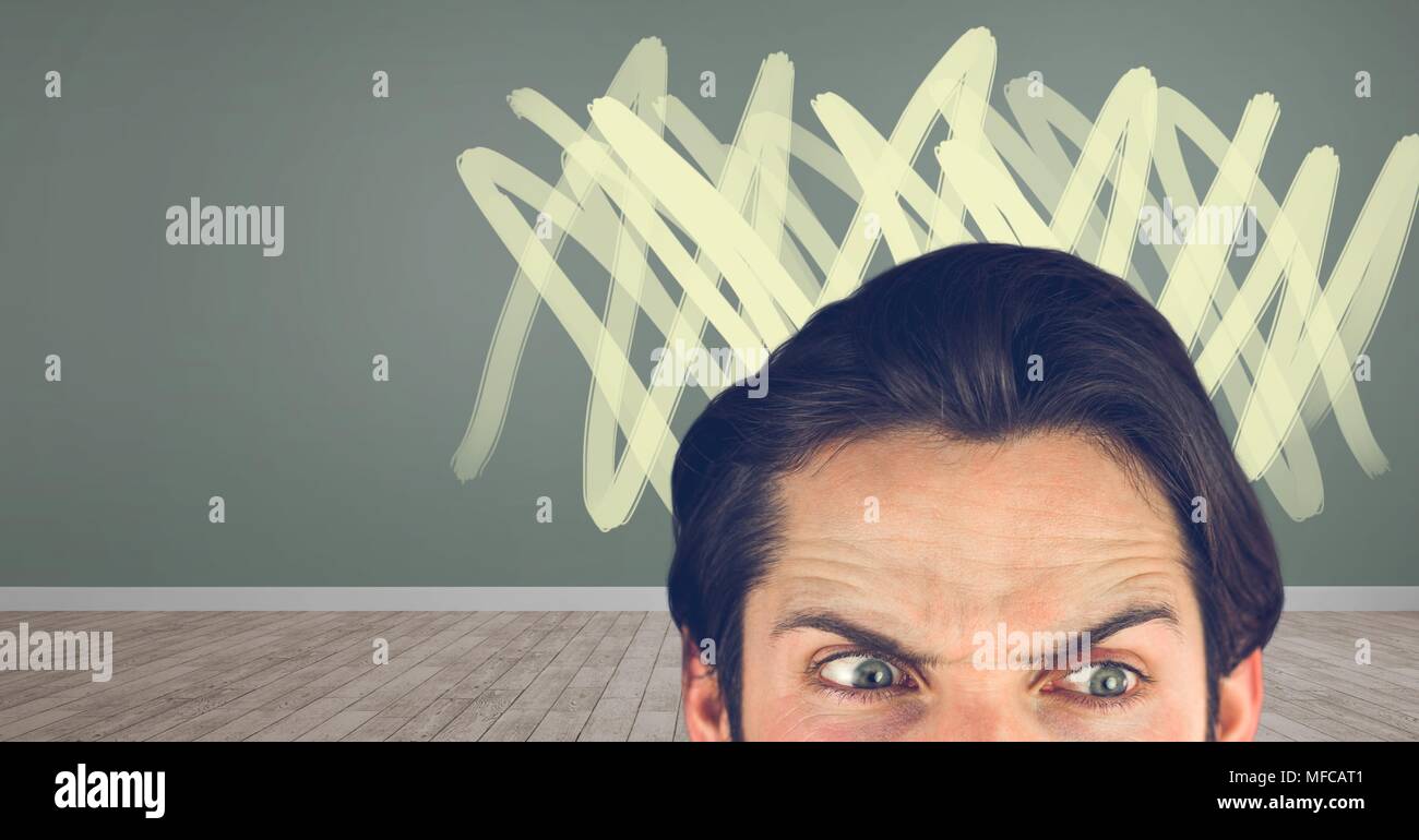 Angry mans eyes with doodles in room Stock Photo