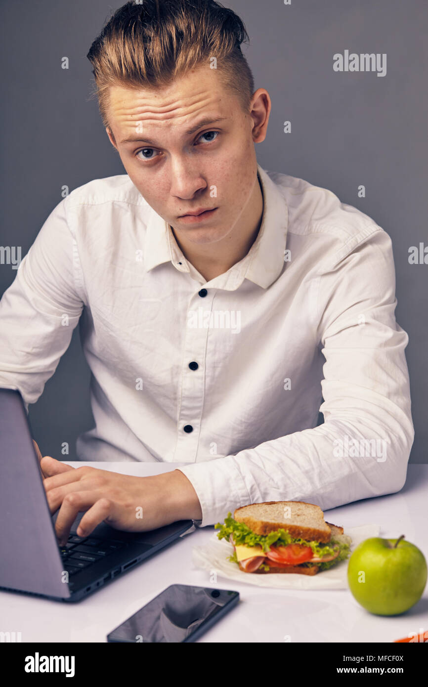 man while lunch at the office looking at camera Stock Photo