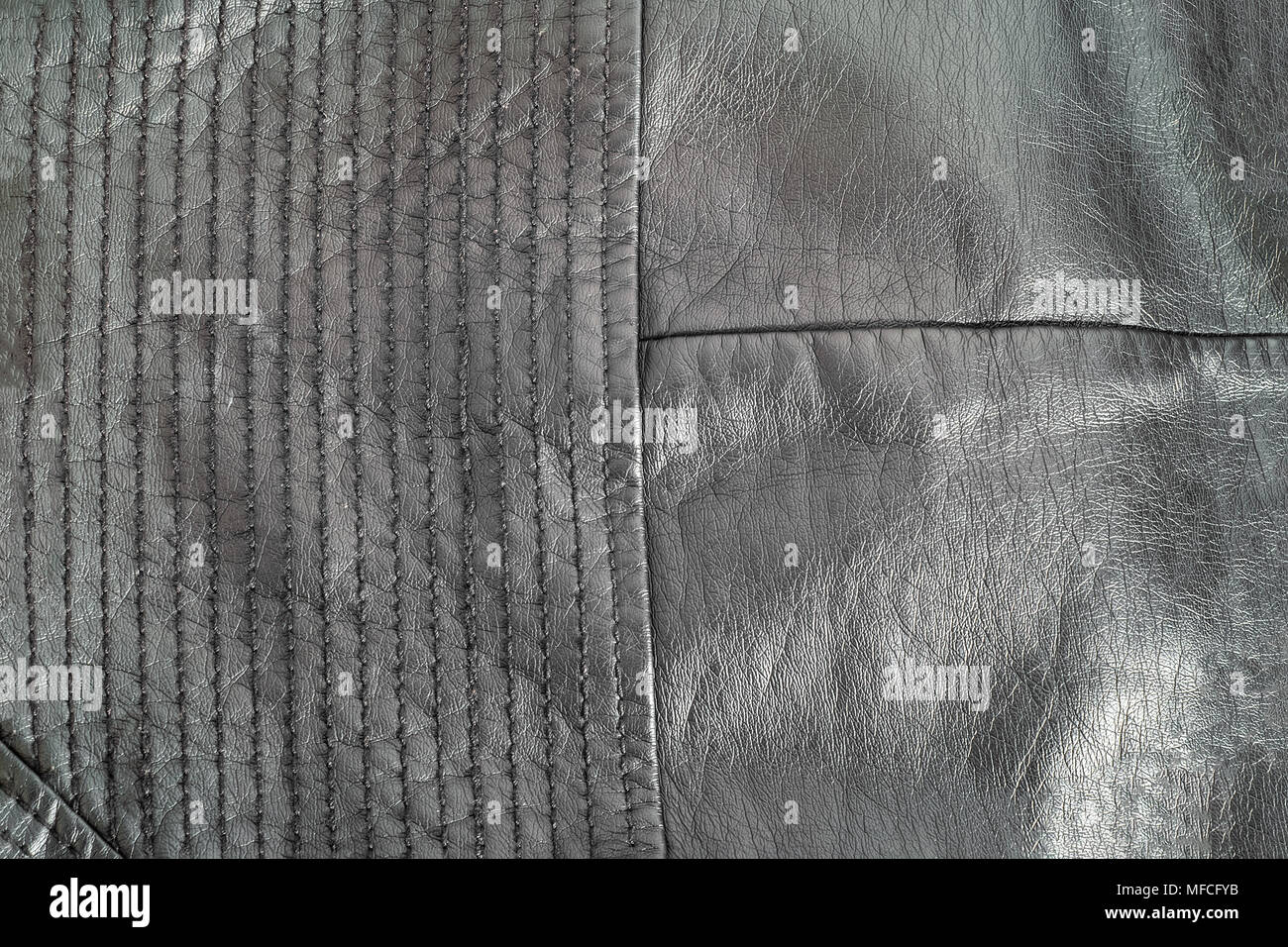black Natural leather texture with stitches. Closeup. Stock Photo