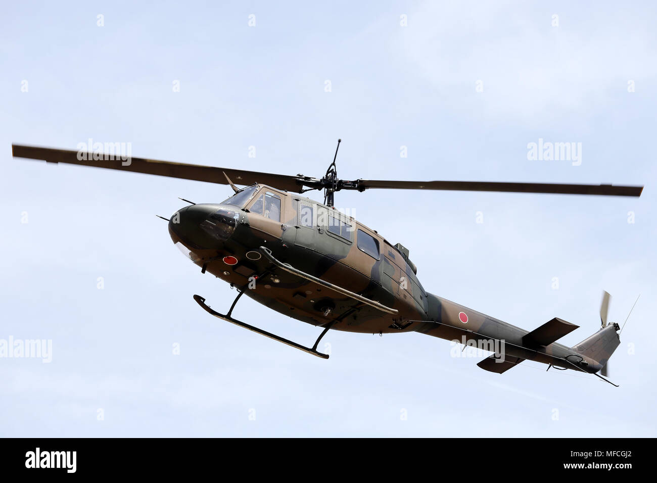 Japanese military helicopter in flight, Military helicopter flying Stock Photo