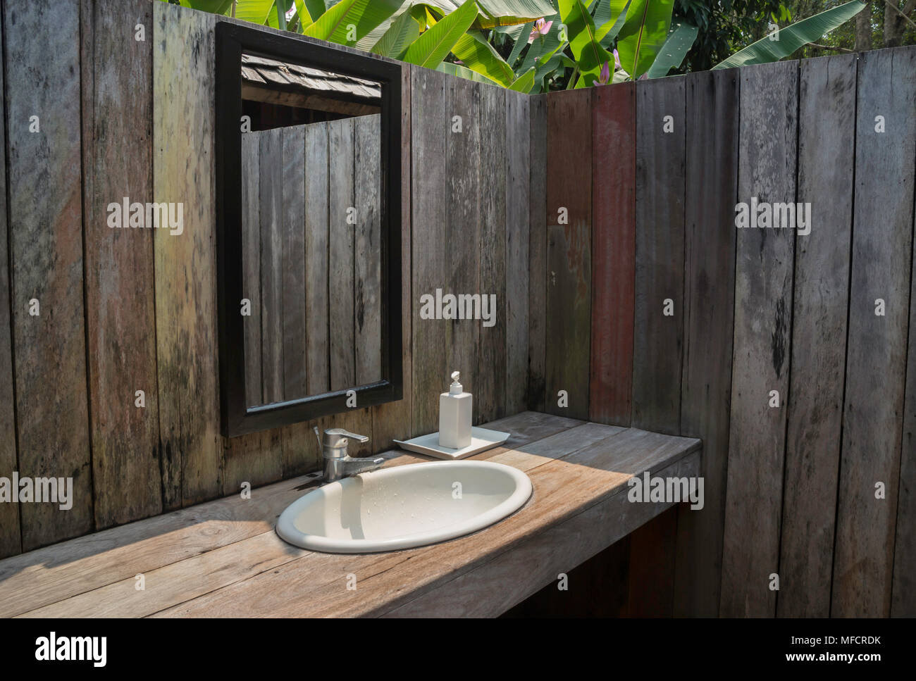 Outdoor bathroom with tropical garden Stock Photo - Alamy