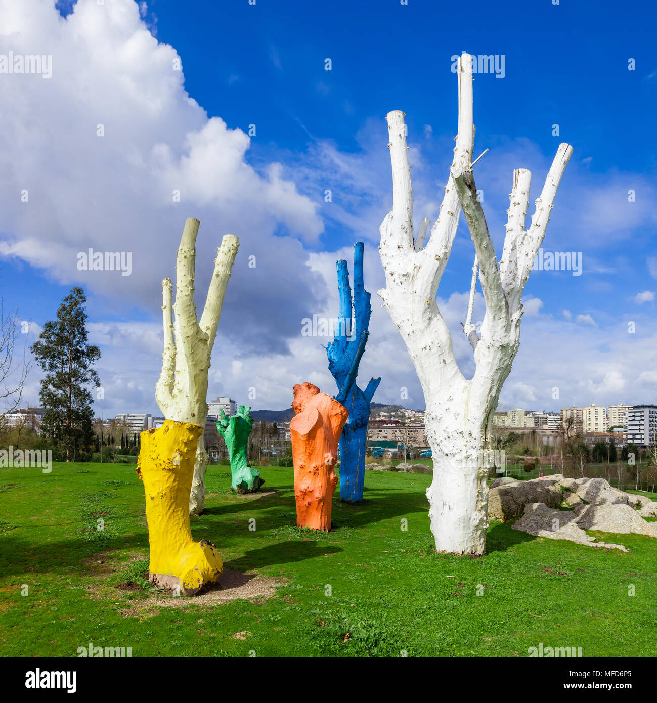 Vila Nova de Famalicao, Portugal - March 31, 2018: Urban art made of colorful painted dead trees in Parque da Devesa Urban Park. Stock Photo