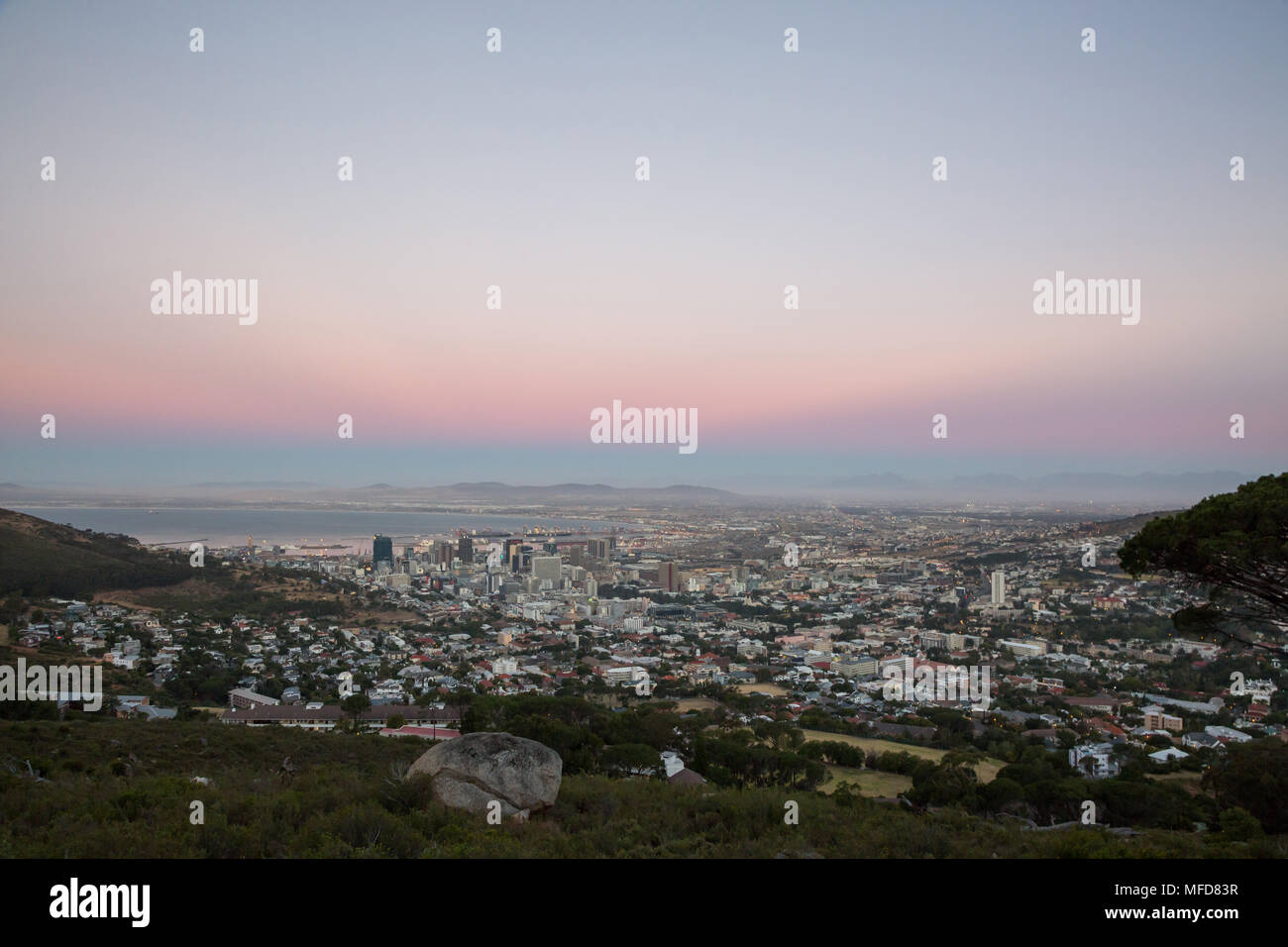 View of sun setting over City Bowl in Cape Town with colors Stock Photo