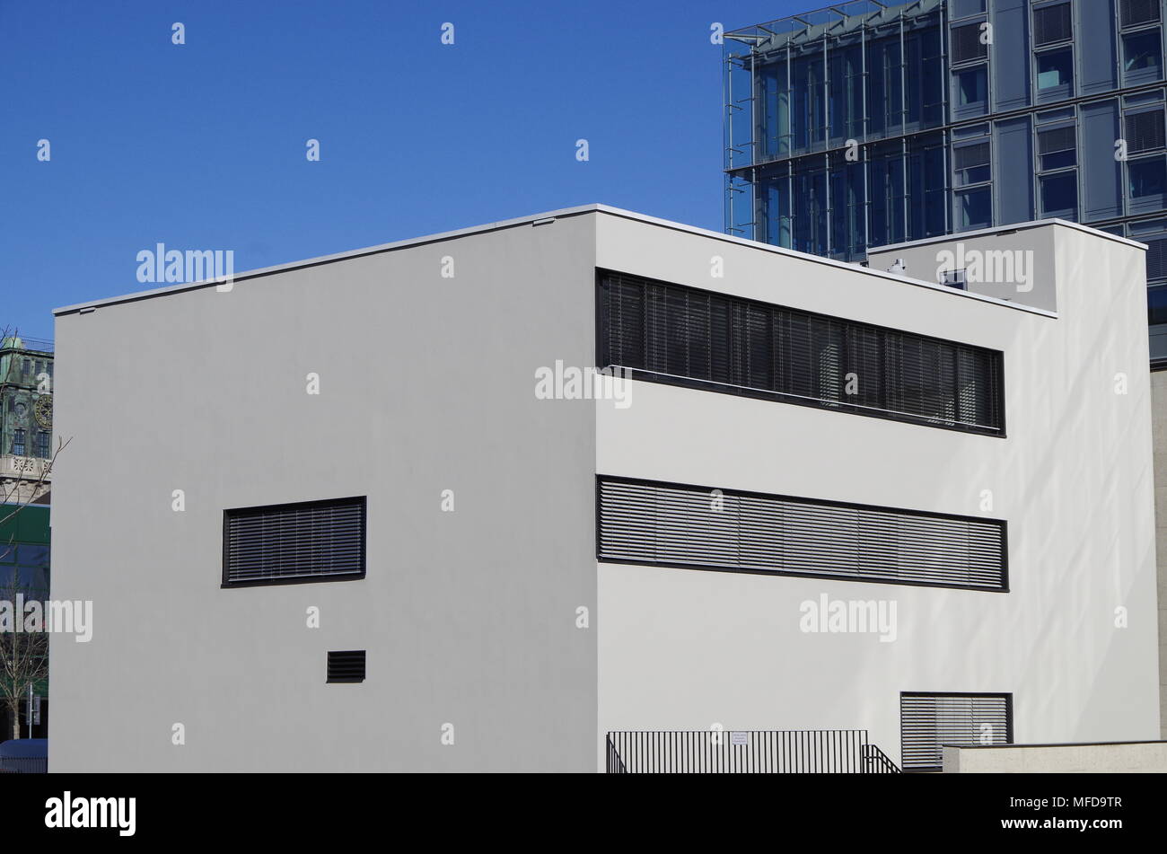 A simple arrangement of white walls and black-painted ventilation grills reminiscent of early Modern Movement villas Stock Photo