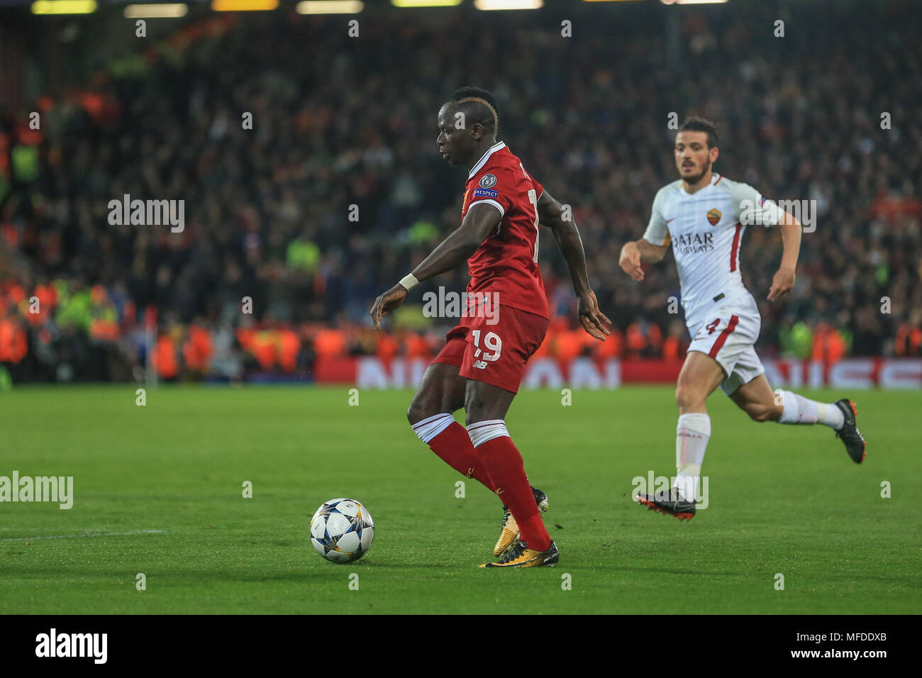 Liverpool, UK. 24th April, 2018. 24th April 2018 , Anfield, Liverpool, England; UAFA Champions League Semi Final, first leg, Liverpool v Roma ; Sadio Mane of Liverpool looks for a target as he prepares to cross the ball Credit: News Images /Alamy Live News Stock Photo
