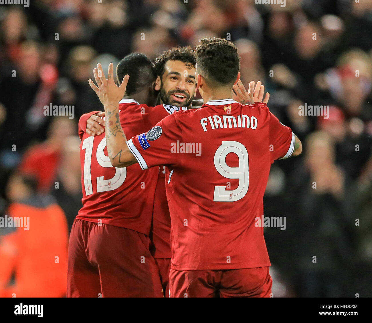 Liverpool, UK. 24th April, 2018. 24th April 2018 , Anfield, Liverpool, England; UAFA Champions League Semi Final, first leg, Liverpool v Roma ; Sadio Mane of Liverpool celebrates his goal with Mohamed Salah of Liverpool and Liverpool and Roberto Firmino of Liverpool Credit: News Images /Alamy Live News Stock Photo