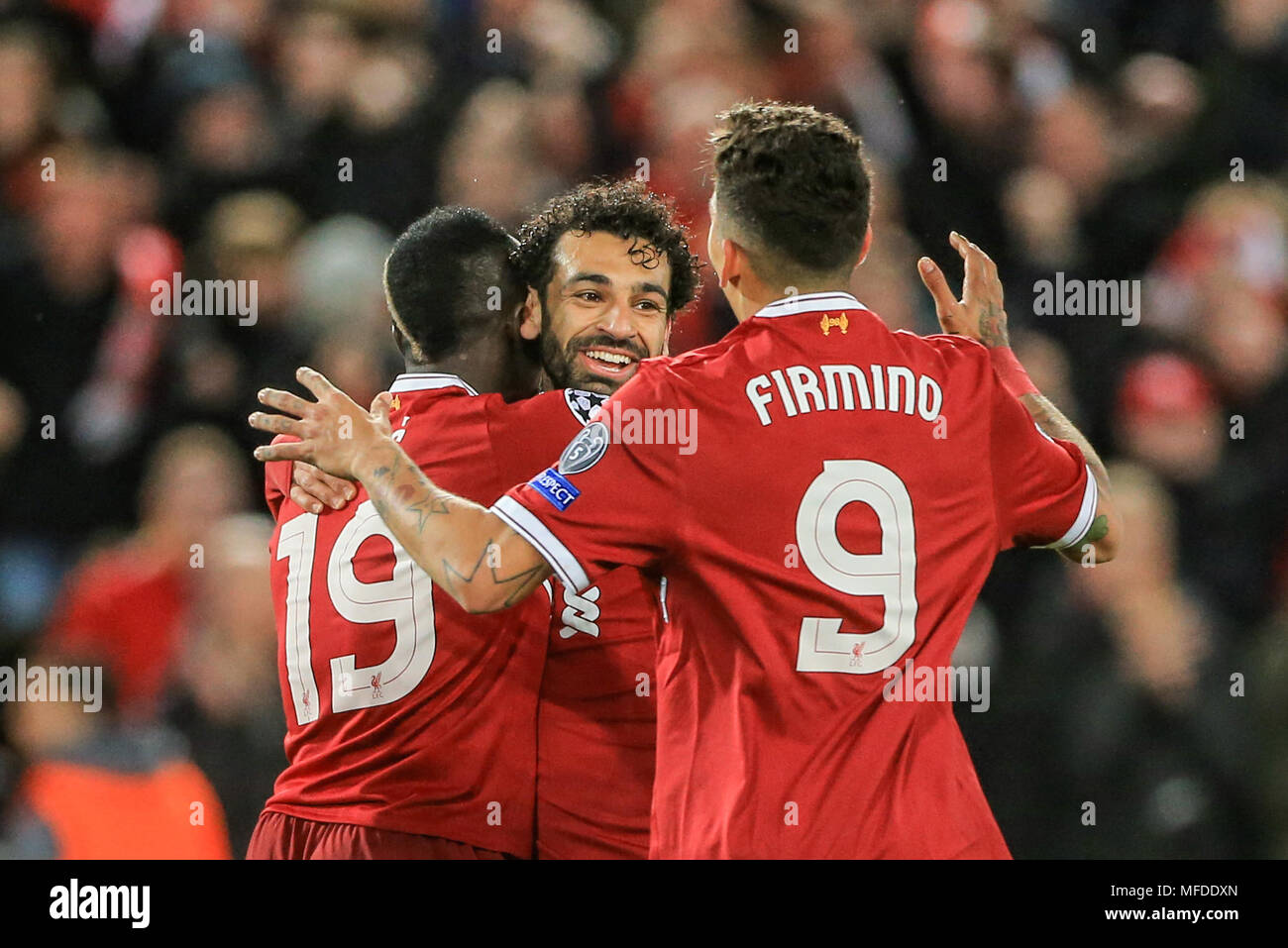 Liverpool, UK. 24th April, 2018. 24th April 2018 , Anfield, Liverpool, England; UAFA Champions League Semi Final, first leg, Liverpool v Roma ; Sadio Mane of Liverpool celebrates his goal with Mohamed Salah of Liverpool and Liverpool and Roberto Firmino of Liverpool Credit: News Images /Alamy Live News Stock Photo