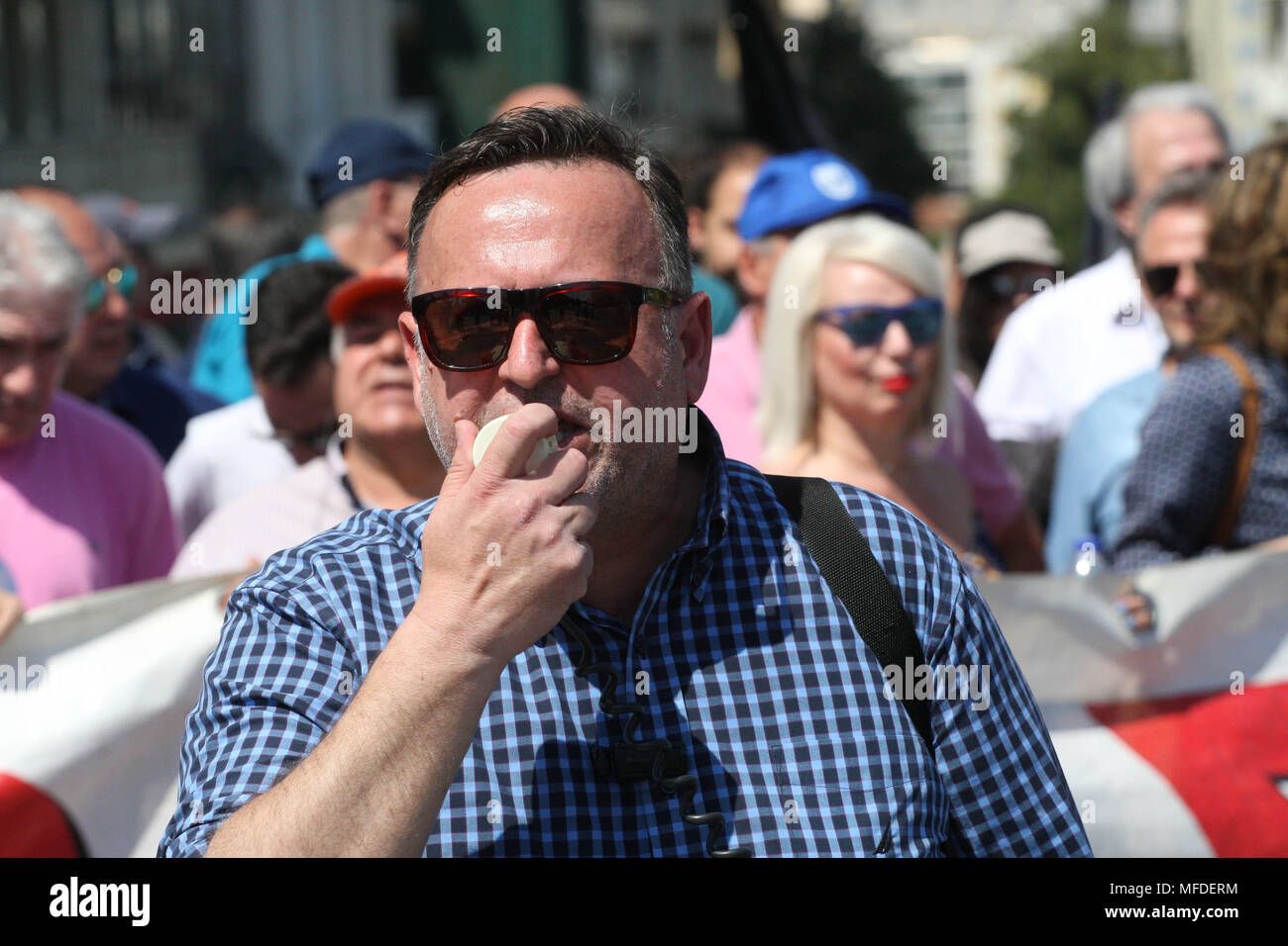 Athens, Greece. 25th Apr, 2018. State electricity supply company workers protest in central Athens. Thousands of people have taken to the streets of Athens to protest against a number of bailout-related reforms, including the sale of some power plants, potential pension cuts and staffing funding cuts for state-run hospitals. Credit: Aristidis Vafeiadakis/ZUMA Wire/Alamy Live News Stock Photo