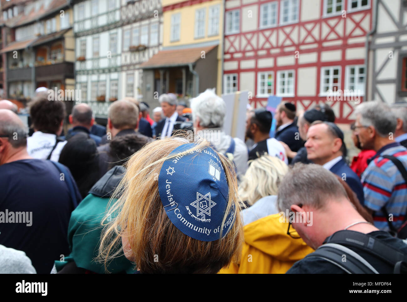 Erfurt, Germany. 25 April Germany, Germany, Erfurt: A participant in a demonstration wearing a Kippa in the city centre of Erfurt. The demonstration in front of the new synagogue in Erfurt takes a stance against anti-Semitism and exclusion. Photo: Bodo Schackow/dpa-Zentralbild/dpa Credit: dpa picture alliance/Alamy Live News Stock Photo