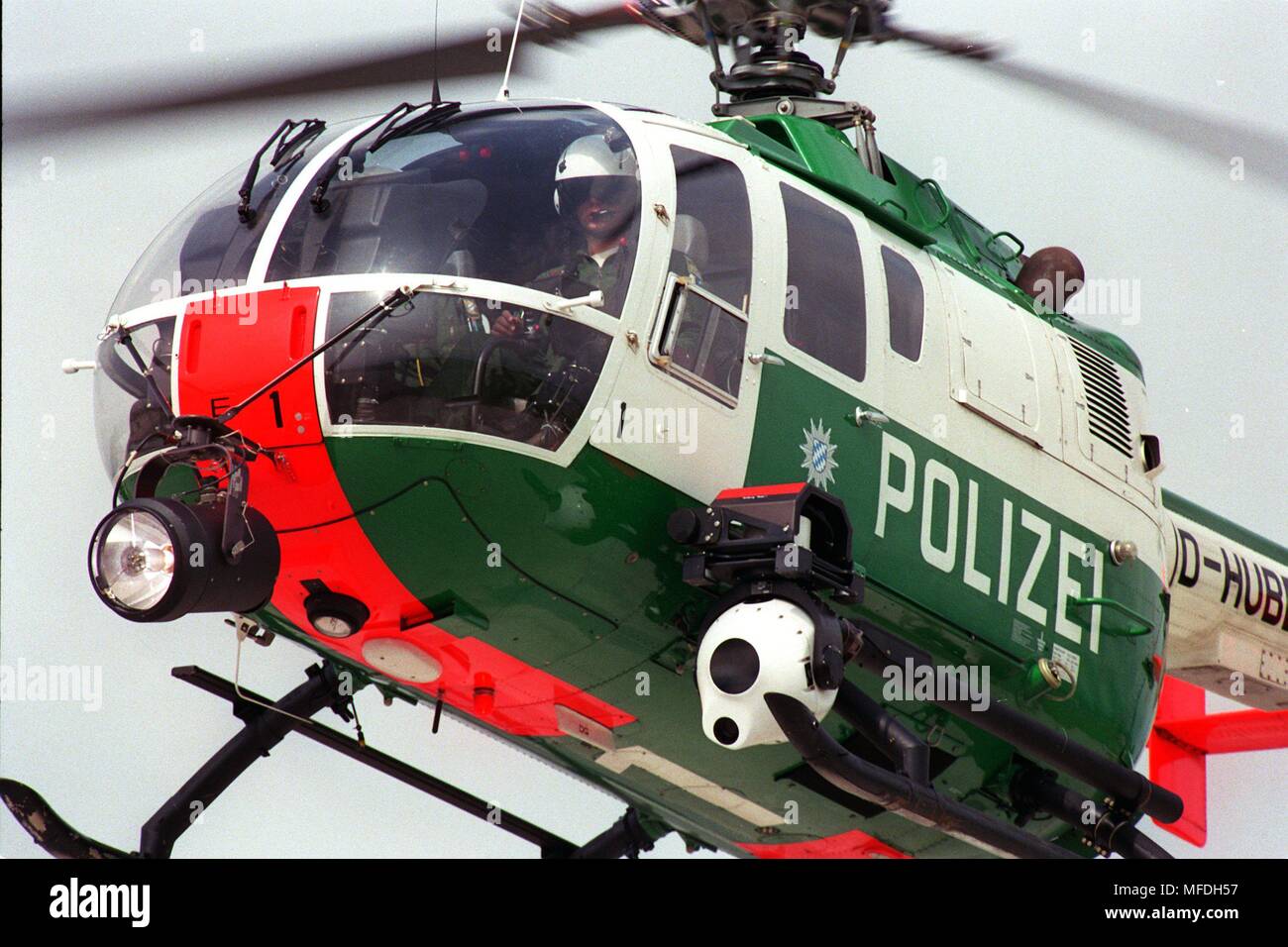 with the aid of a warm-image camera (below), the Bavarian 'Edelweiss 1' helicopter can also track the criminals of the Bavarian riot police. The medicine ball-sized white ball, which is cooled to minus 180 degrees, can distinguish between up to two kilometers away hot and cold and thus make out about an aligned gangster in the forest. Under the pulpit of the helicopter there is also a powerful searchlight attached. The several 100,000 DM expensive, unique in Germany system that has been in use for about half a year, already made considerable search successes possible. | usage worldwide Stock Photo