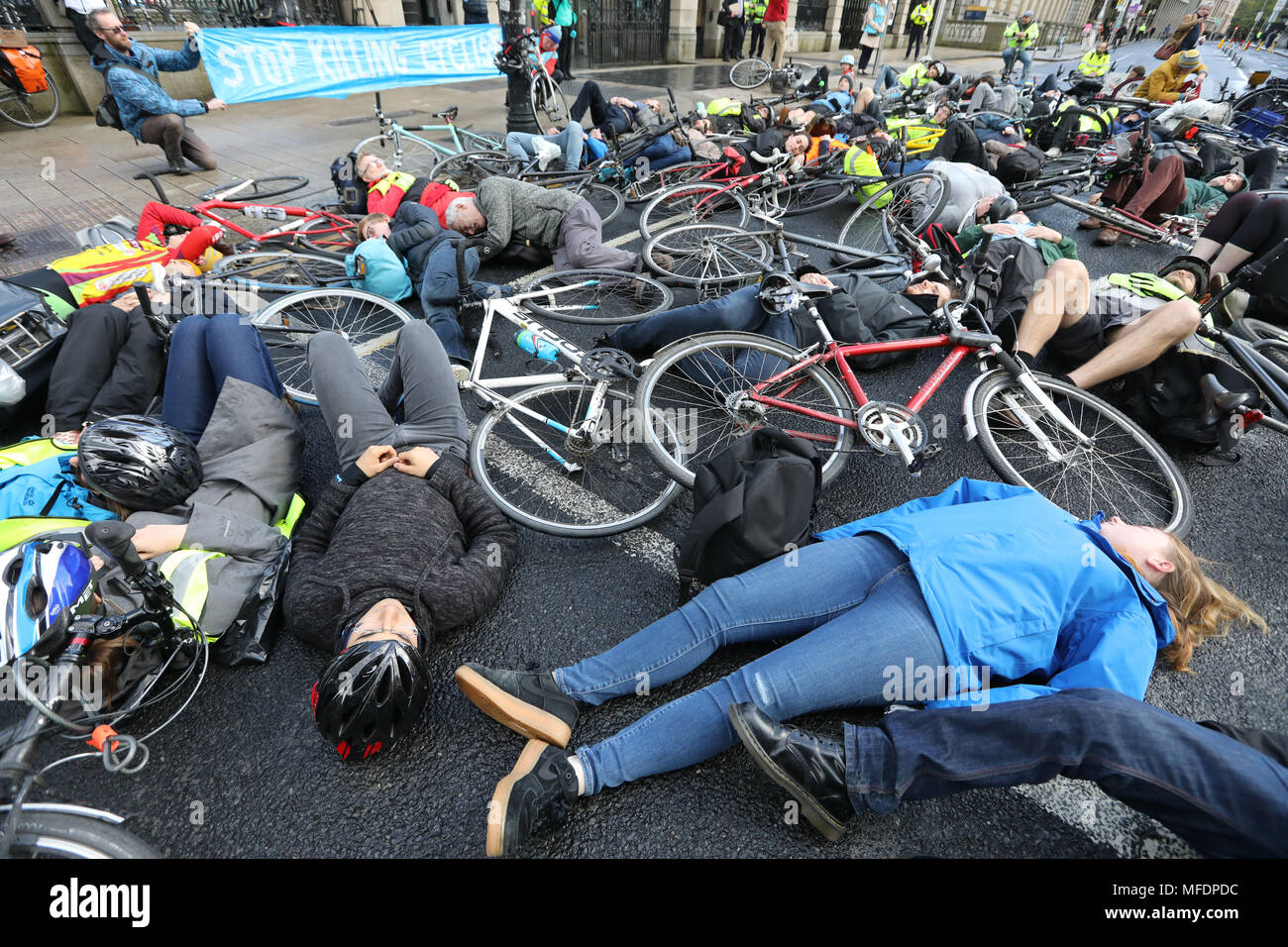 Dublin, Ireland. 25th Apr, 2018. Stop Killing Cyclists. Cyclists protest outside the Leinster House (the Dail), in Dublin, Ireland, demanding more protection on the roads as another cyclist was killed this week. I Bike and Dublin Cycling Campaign are calling for a minimun of 10% of the transport budget to be allocated to safe cycling and walking. They also want a better design of cycling and walking infrstructure. Five cyclists have so far been killed this year, with 15 deaths last year. Photo: Eamonn Farrell/RollingNews.ie Credit: RollingNews.ie/Alamy Live News Stock Photo