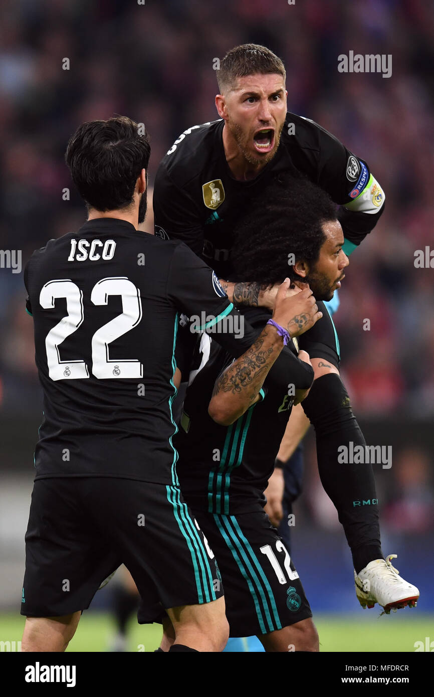 Munich, Germany. 25th Apr, 2018. 25 April 2018, Germany, Munich: Soccer, Champions League, knockout round, semi-final, first-leg, Bayern Munich vs. Real Madrid. Madrid's goalscorer Marcelo celebrating his goal that made it 1:1 with team mates with Isco (L) and Serios Ramos (above). Credit: Sven Hoppe/dpa/Alamy Live News Stock Photo