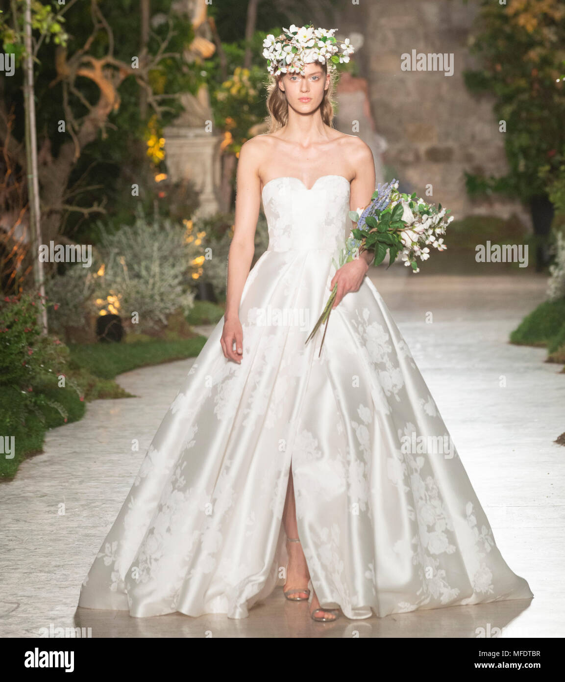 Barcelona, Spain. 25th April, 2018. A model showcases designs by Reem Acra on the show during Barcelona Bridal Fashion Week 2018 at Fira de Barcelona on April 25, 2018 in Barcelona, Spain. © Victor Puig/Alamy Live News Stock Photo
