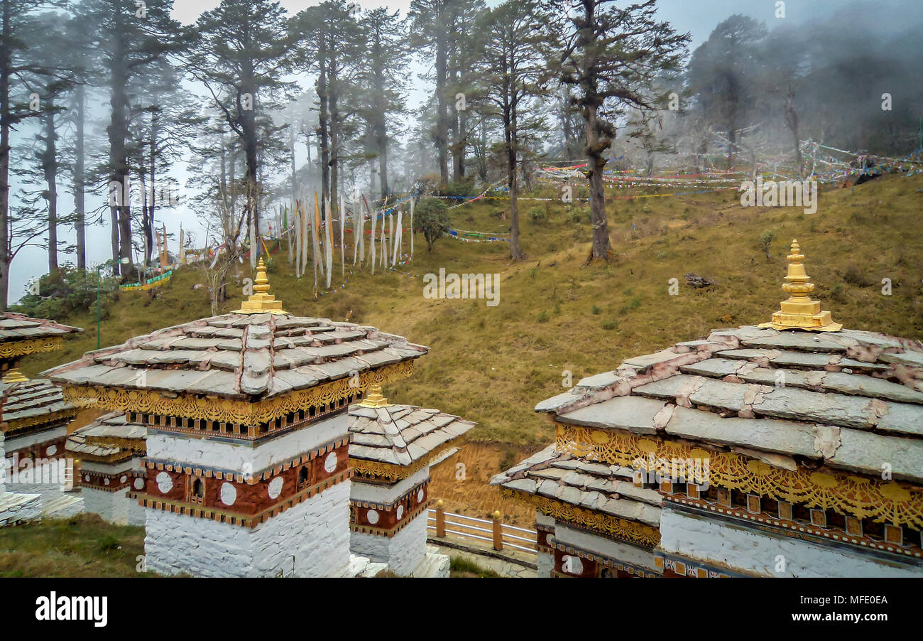 The 108 chortens or stupas is a memorial in honour of the Bhutanese soldiers with layer of mountains at Dochula Pass on the way to Thimphu from Punaka Stock Photo