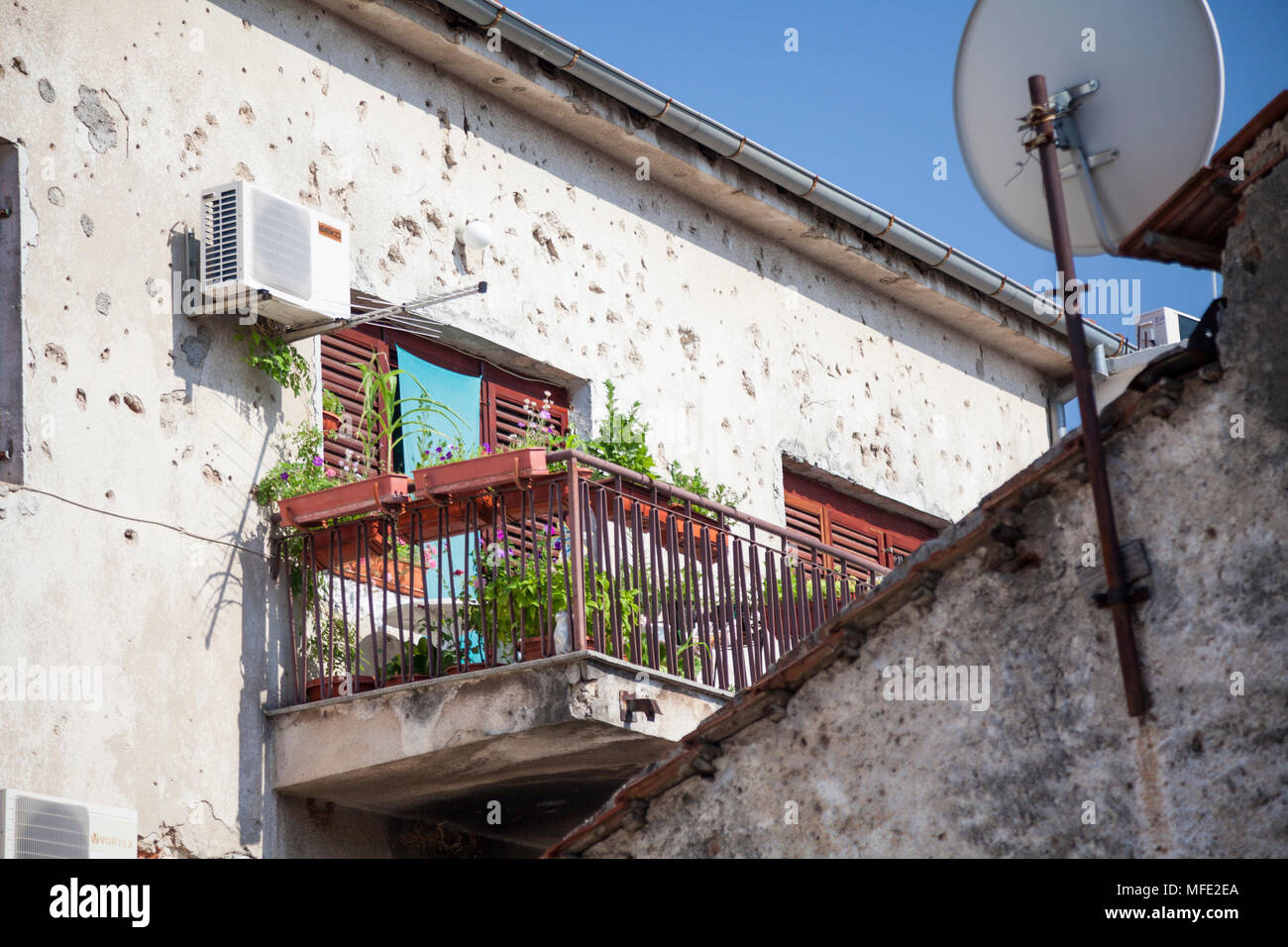 A balcony surrounded by bullet damaged walls in Mostar, Bosnia and Herzegovina Stock Photo