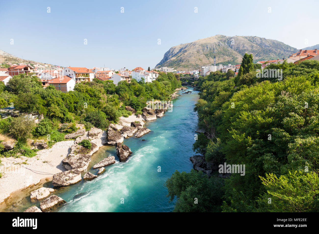 View down the Neretva River towards the mountains in Mostar, Bosnia and Herzegovina Stock Photo