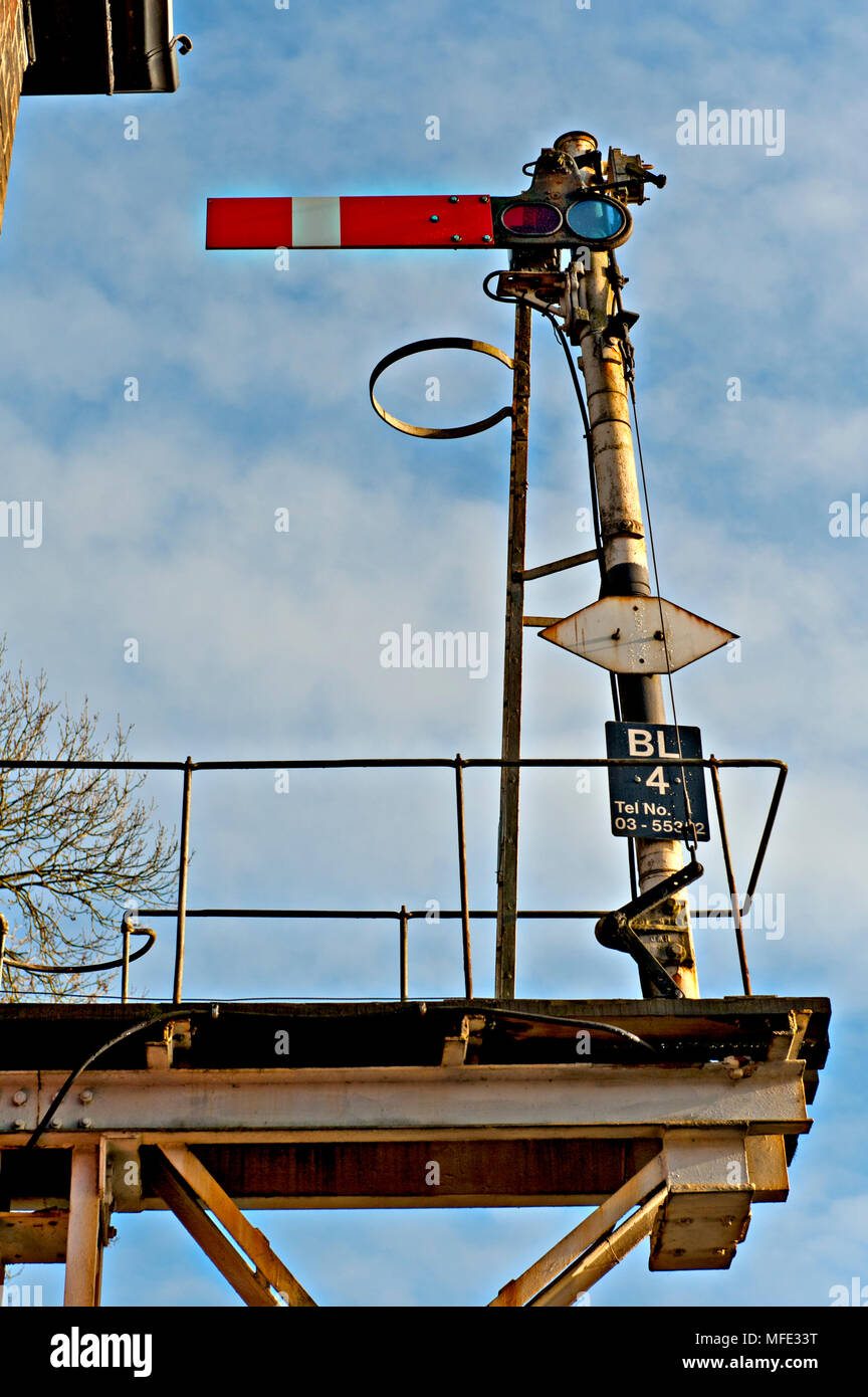 A semaphore starter stop signal in elevated position at Brundall Railway Station on the Wherry Lines in Norfolk, UK Stock Photo