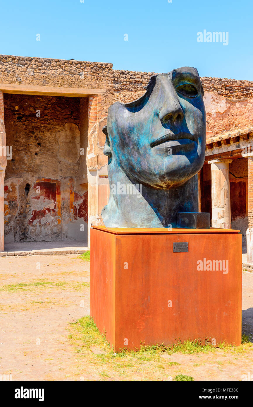 Statue of face in Pompeii, an ancient Roman town destroyed by the