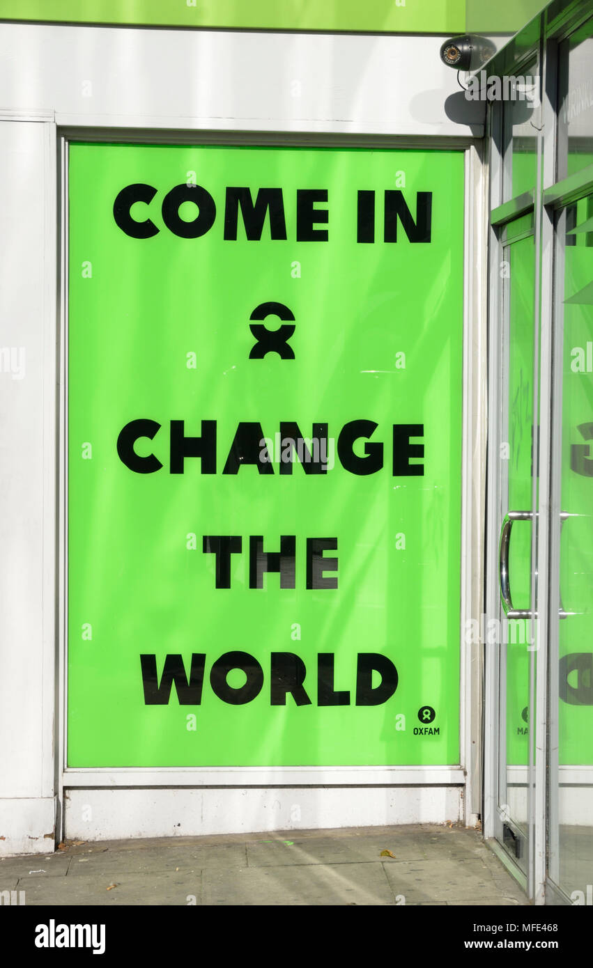 ’Come in and change the world’ sign outside a shop Stock Photo