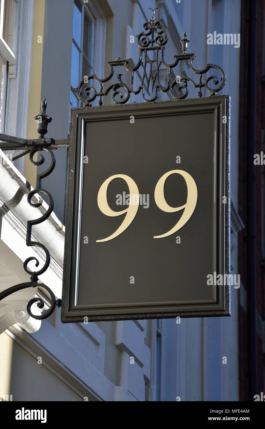 Number 99 ninety-nine on a sign outside a property Stock Photo