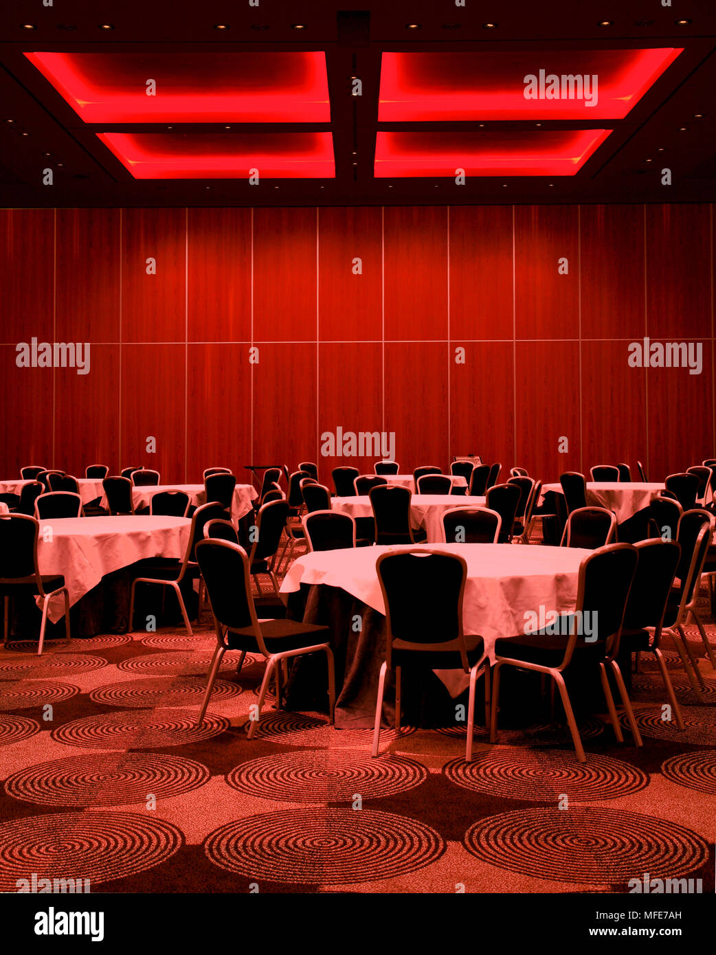 Convention and conference room illuminated in red. Sofitel London Heathrow, Hounslow, United Kingdom. Architect: Stephen Williams, 2008. Stock Photo