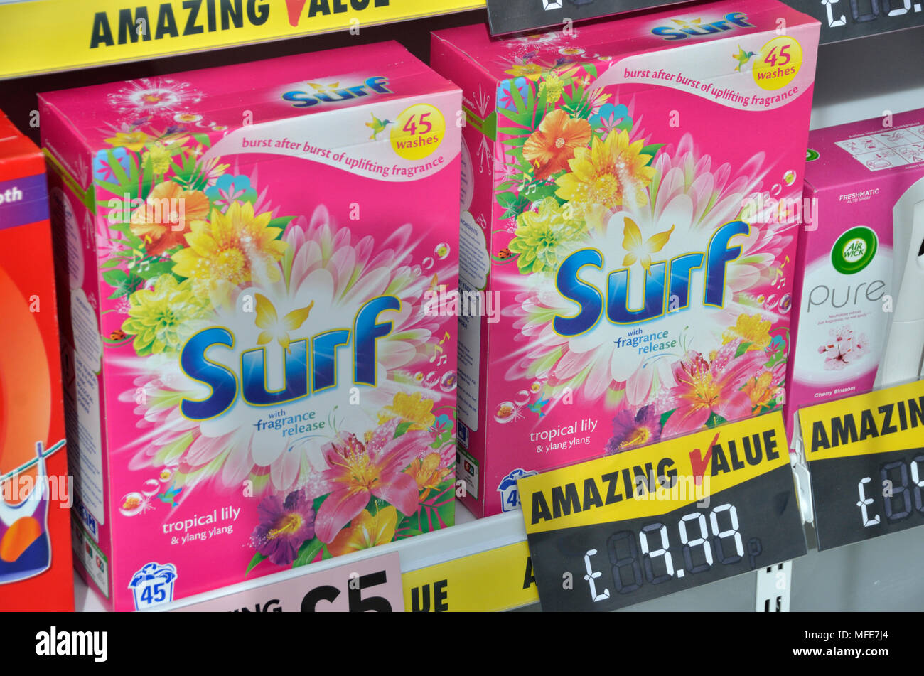 Surf washing powder boxes in a shop window. Stock Photo