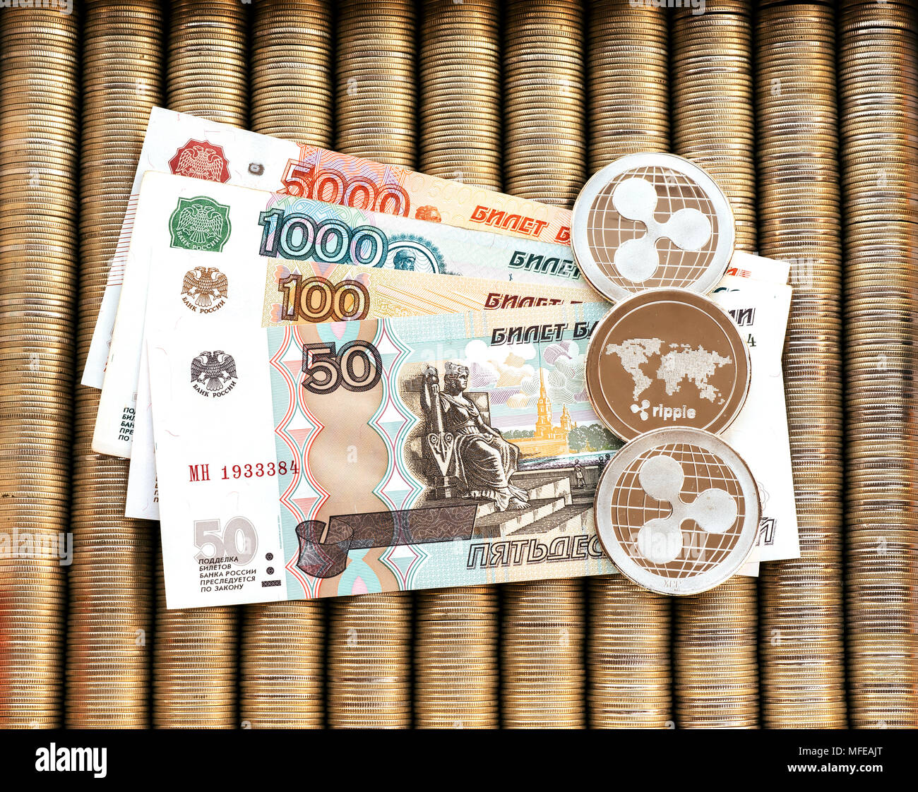 Silver crypto coins Ripple XRP, paper Russian rubles. Metal coins are laid  out in a smooth background to each other, close-up view from the top, crypt  Stock Photo - Alamy